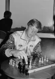 German tennis player Boris Becker passes the time with a chess boar - Old Photo