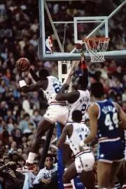 Michael Jordan and Moses Malone Eastern All Stars jump for a rebou- Old Photo 1