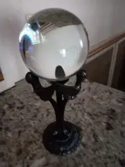 Clear crystal ball sphere and stand.