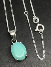 turquoise oval pendant solid Sterling Silver. 11 x 9mm. Claw set. Chain, box