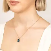 9ct Gold 5.6ct London Blue Topaz in Emerald Cut and 1/10 Carat Diamond Pendant, 9ct Yellow Gold Silver Filled 45cm Curb Chain 30 gauge (15250346)