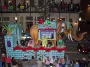 Costumed men ride on elephants back Mardi Gras began in Mobile Alabama in 1703 when it was a colony of French soldiers Colorful beads and Moon Pies (two large cookies with marshmallow in between and c
