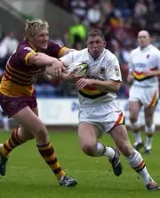 Bradford Bulls' Mike Forshaw tries to evade Eorl Crabtree of Hudd - Old Photo