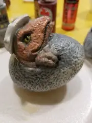 Velociraptor Dinosaur Baby in Egg Unpainted Ceramic Bisque