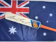 Aaron Finch (Australia) signed New Balance (Blue/Orange) mini cricket bat + COA