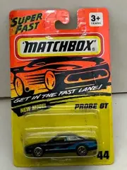 1993 MATCHBOX SUPERFAST #44 BLACK FORD PROBE GT NEW ON DAMAGED CARD