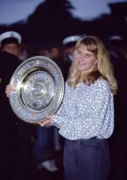Steffi Graf of Germany poses with the trophy after defeating Monic- Old Photo 2