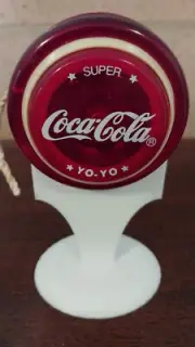 VINTAGE 1996 COCA COLA RUSSELL SUPER YOYO. UNUSED. INCLUDES DISPLAY STAND.
