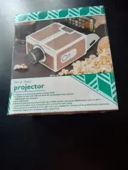 In a Box Projector (New in box) Rite Aid. Use with iOS and Android Smart Phones
