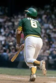 Sal Bando Oakland Athletics swings and watches the flight of his - 1974 Photo 1