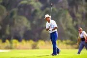 Golfer Juan Chi Chi Rodriguez swings and watches the flight of Golf 1988 Photo 9