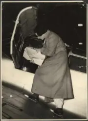 Portrait of Jean Batten studying charts whilst standing AVIATION OLD PHOTO