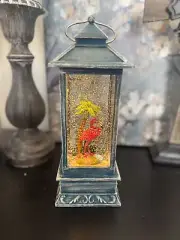 snow globe with pink flamingo