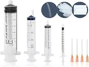 Syringe set with cannulas and storage caps for use as a dosing syringe, rinsing syringe, enema syringe, marinating syringe, etc.,