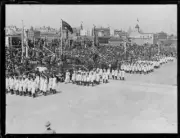 School children walking past the crowds at the opening of the Sydn- Old Photo