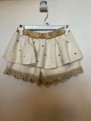 Child NWT "Yami" ivory with gold accents SKORT. No size indicated Waist 11"