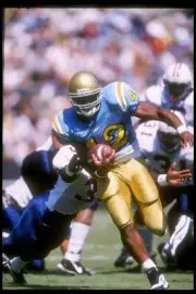 Running back Skip Hicks of UCLA carries the football at the Bruins- Old Photo