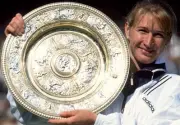 Steffi Graf of Germany poses with the trophy after defeating Arant- Old Photo 1