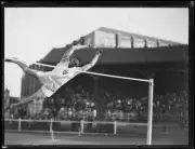 Athlete Jack Metcalfe approaching the bar during a high jump, NSW,- Old Photo