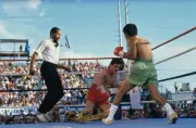 Referee Richard Steele looks on as Irish boxer Barry McGuigan fall- Old Photo