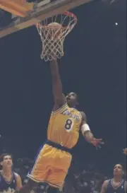 Kobe Bryant Los Angeles Lakers jumps up to slam dunk the ball the - Old Photo