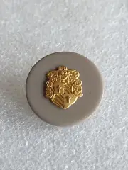 Button with a Coat of Arms on it
