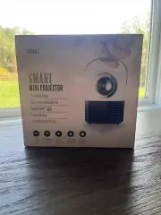 New In Box Smart Portable Mini Projector 1080P HD Apple and Android Compatible