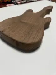 Black walnut guitar shaped cheese or cutting board. Also could be home decor