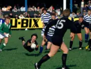 Carl Gnojek of Neath RFC passes the ball during a rugby union mat - Old Photo