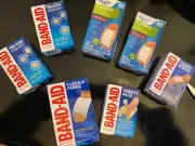Band-Aide Lot / And Equate. Total Of 7 Boxes And 180 Different Size Badges.