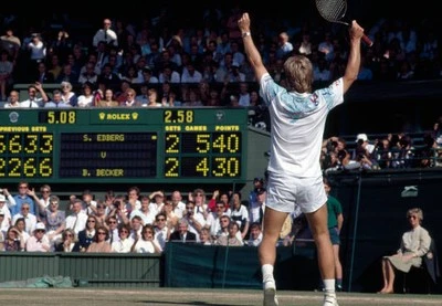 Stefan Edberg of Sweden celebrates as he defeats Boris Becker of W- Old Photo