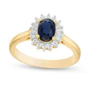 Oval Blue Sapphire and 0.20 CT. T.W. Baguette and Round Natural Diamond Starburst Frame Ring in Solid 10K Yellow Gold