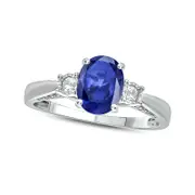 Oval Lab-Created Blue and White Sapphire with 0.07 CT. T.W. Diamond Three Stone Ring in Sterling Silver