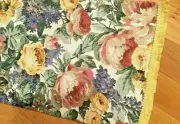 Table runner, flowers, red, yellow on the white with the liner and yellow trim.