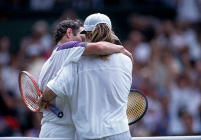 John McEnroe USA embraces Andre Agassi USA after McEnroe loses the- Old Photo