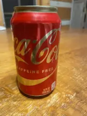 Unopened, factory error, sealed, empty (tiny amount liquid) Coca Cola can