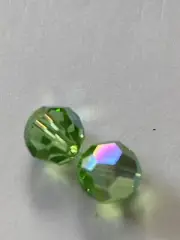 10 Swarovski Crystal Peridot 6mm Round. Free postage no tracking