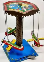 Airplane Tin toy carousel Vintage Tinplate clockwork windup toy. 4-1/2"
