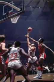 Walt Frazier of the New York Knicks drives to the basket against J- Old Photo