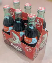 1991 Christmas Coke Bottles. All Full.