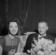Actress Barbara Rush and escort attend the Academy Awards in LA 1957 Photo