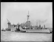Tugboat alongside the H.M.A.S. Albatross as it enters Cockatoo Isl- Old Photo