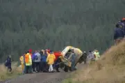 Mirco Baldacci spectators help to put the damaged Suzuki Ignis bac - Old Photo