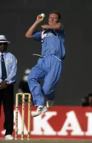 Dougie Brown bowling for England during the Akai Singer Champ- Cricket Photo 1
