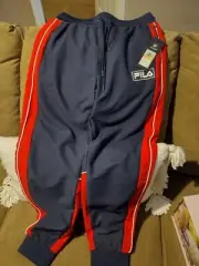 Fila Navy Blue Tapered Shadow Wind Pants. With 3 Pockets. Size Medium.
