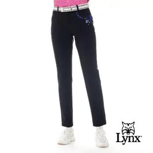 【Lynx Golf】女款日本進口布料彈性舒適LOGO鬆緊帶設計口袋配布剪接造型窄管長褲(黑色)