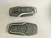 2 Ford Mustang Remote Key Fobs 1 with Transponder and the other is a Shell only.
