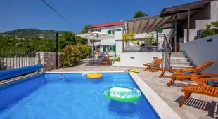 Villa LETA, luxurious 5 stars villa in a green oasis with fitness, heated pool, playground & barbecu