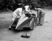 Mechanics working on Leon Cushman's Austin 7 racer for a speed rec - Old Photo 3