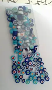 Mandala art smurf pebbles millefiori style glass for craft and mosaic work.